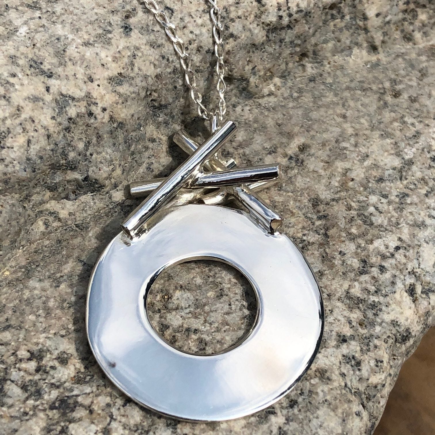 Dije Círculo de Plata