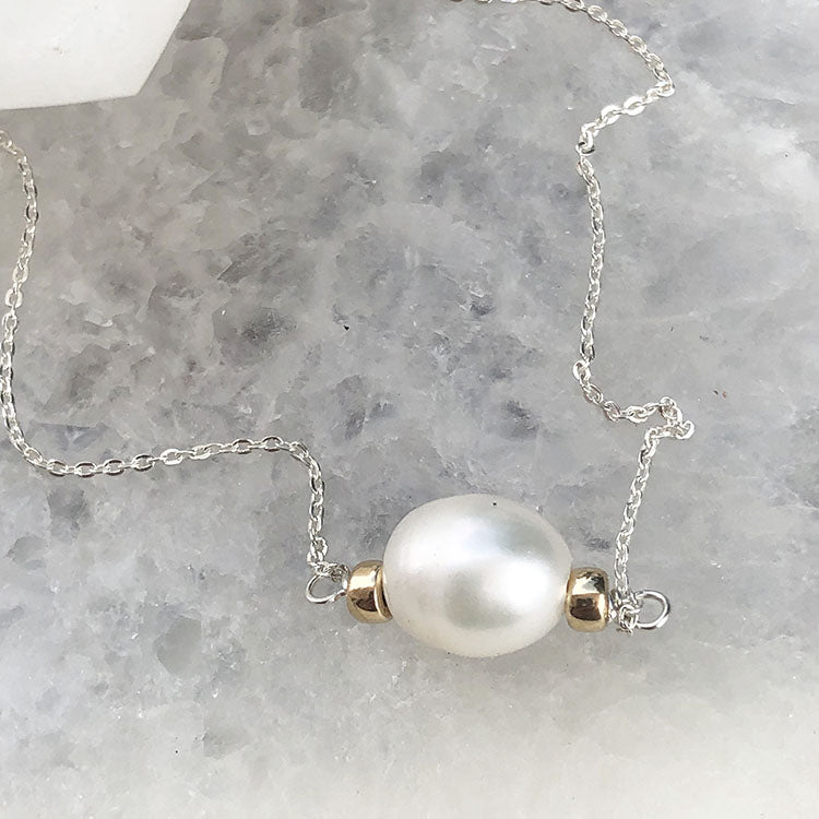 Dije de plata con perlas