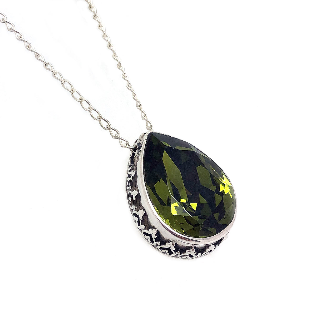 Dije de plata con cristal